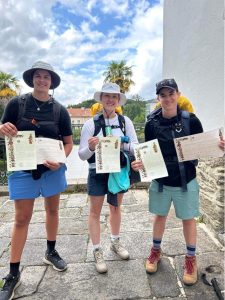 Hannah Page with 2 friends, all holding certificates